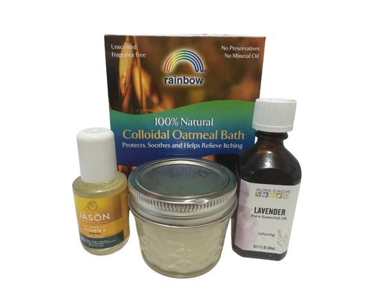 Collection of natural products including a jar, bottles, and a box on a white background